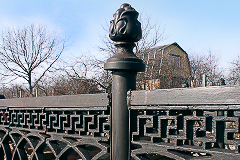 A fragment of the fence with decorated pole and a knob